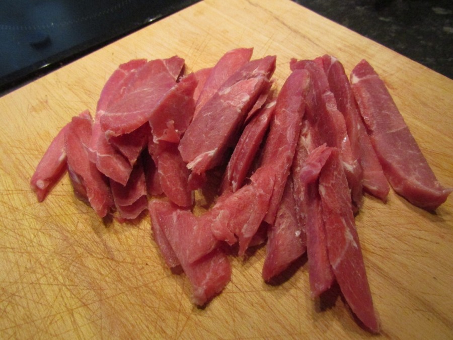Thinly sliced lamb leg steak.